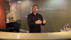 Dr. Skopek of Skopek Orthodontics at the front desk