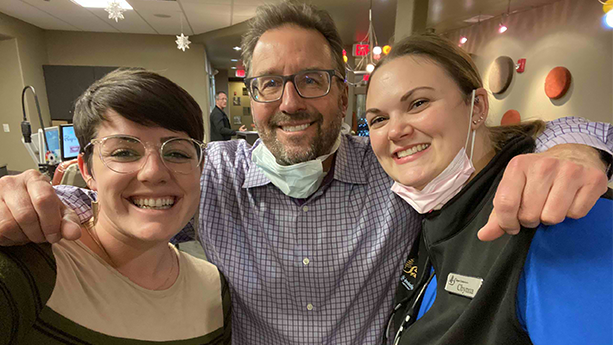 Dr. Skopek and Chynna of Skopek Orthodontic having a fun photo with a patient