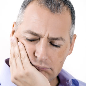 Skopek Orthodontics man experiencing TMJ jaw pain
